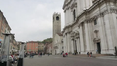 A Close View Of The White Marble Facade Of Duomo Nuovo And The Medieval Tower Video stock 325445423