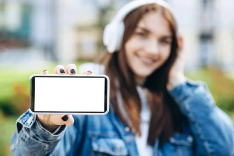 Close-up view of a a white phone screen, copy space in hands Stock Photos