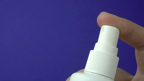 Close up view of white plastic bottle isolated on blue background.Spray splashes Stock-Footage 159450086