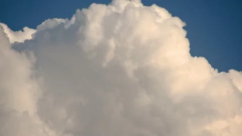 Close up view of white puffy fluffy white clouds against blue sky Stock Footage 157107299