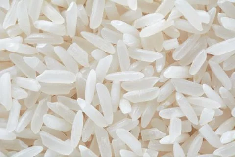 Close up view white rice background for texture. Organic, natural long rice g Stock Photos