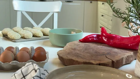 Close-up view of the white table with potato cutlets ingredients Stock Footage 303299643