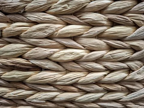 Close up view of wicker material showing natural braided pattern of straw a.. Photos