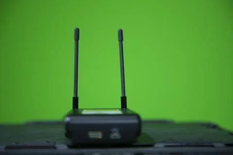Close up view of wireless microphone receiver in chroma shooting studio Stock Photos