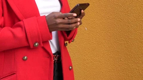 Close up view of a woman checking notifications on her mobile phone while sta Stock Footage 164038410