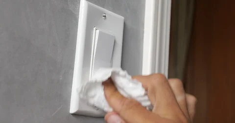 Close up view of woman hand using antibacterial wet wipe for disinfecting home Stock Footage 126948103