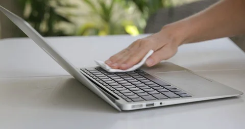 Close up view of woman hand using antibacterial wet wipe for disinfecting laptop Stock Footage 126948224