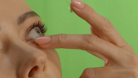 Close up view on woman's eye. Concept of eye disease. Using of contact lens Stock Footage 302551551