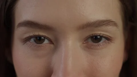 Close-Up View of a Womans Face Focusing on Her Eyes and Nose Video stock 266773125