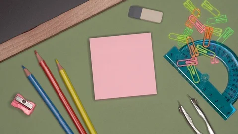 Close up view of womans hand writing A plus excellent mark on sticky notepad. Stock Footage 99032098