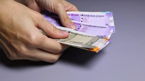 Close up view of woman's hands counting Indian cash money. Stock Footage 303464466