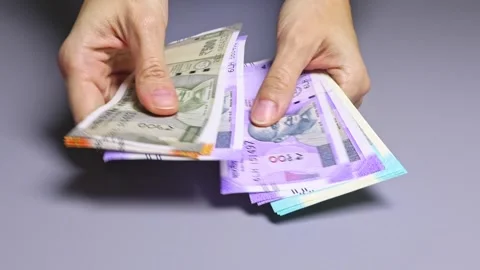 Close up view of woman's hands counting Indian cash money. Video stock 303464473
