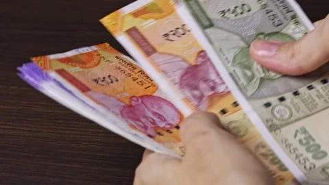 Close up view of woman's hands counting Indian currency notes Stock Footage 304090179
