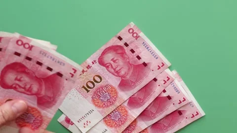 Close up view of woman's hands counting Chinese currency notes. Stock Footage 304808517