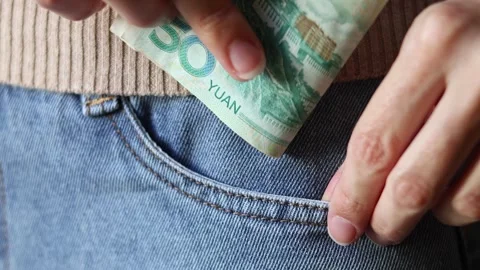 Close up view of woman's hands holding Chinese Yuan (CNY) banknotes. Stock Footage 304441420