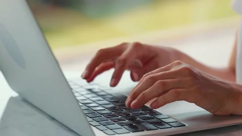 Close up view of woman's hands typing on laptop. Remote work. Home office. Stock Footage 207425904