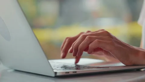 Close up view of woman's hands typing on laptop. Remote work. Home office. Stock Footage 207426171