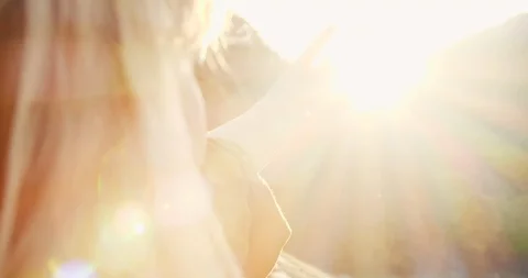 Close up view of Woman’s Nape. Young Girl with Blond Hair Looking at the Sun Stock Footage 99355684