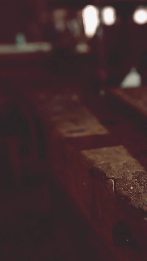 Close view of wooden table surface with soft lighting and shadows at a cafe 動画素材 338417374