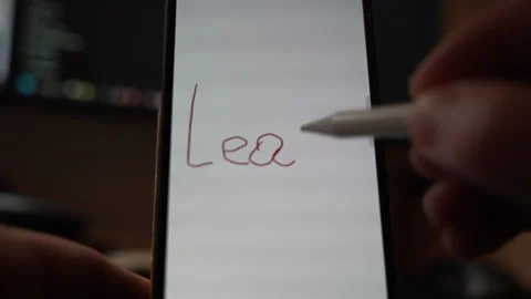 Close view of the word Learn handwritten on a smartphone screen using finger Stock Footage 324711904