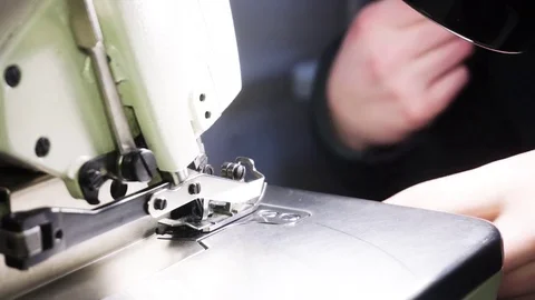 Close-up view of the work machine for overlock. Creating clothes Stock Footage 72403547