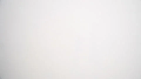 Close-up View of Worker Paints the Wall with a Roller in Light Tones Stock Footage 125714496