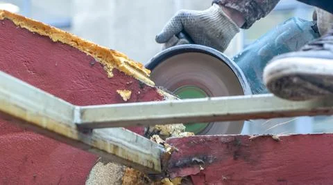 Close-up view of a worker working with angle grinder. Electric wheel grinding Stock-Fotos