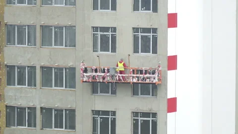 Close-up view of Workers on Construction Site. Building Under Construction Stock Footage 105537134