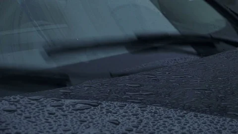 Close-up View of Working Car Wipers are Removing Rain from the Windshield. 4K Stock Footage 81599718