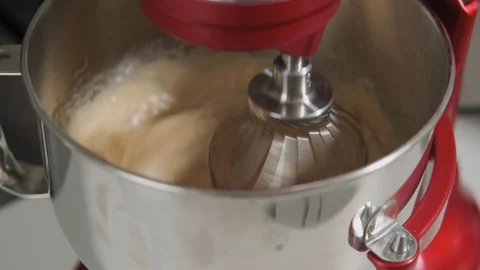 Close-up view of working mixer standing in kitchen. Mixer blending ingredients Video stock 108330578