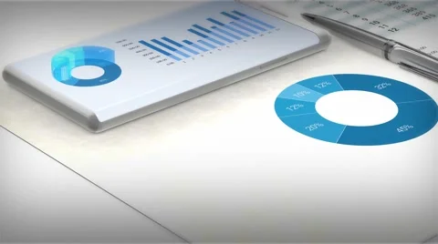 Close-up view to a workspace with graphics on paper and a smartphone Stock Footage 64102635