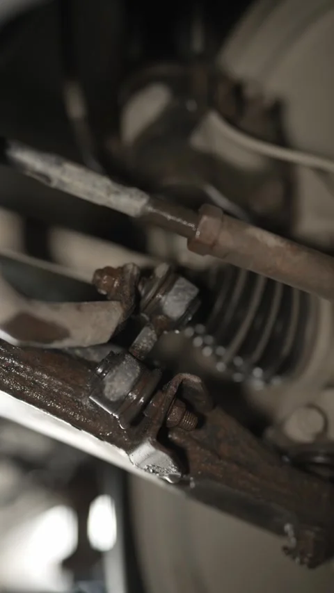 A close-up view of a worn sway bar link on a car suspension. Stock Footage 340977260