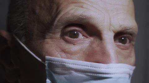 Close view of wrinkled face of senior man wearing protective mask Stock Footage 166795209
