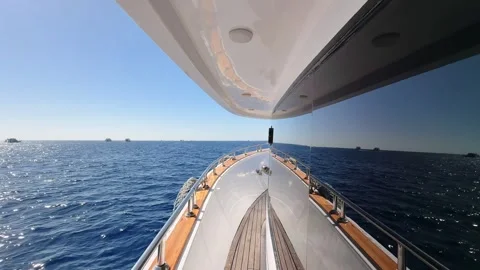 Close up view of yacht deck side with tinted window floating in the blue sea Stock Footage 341405959