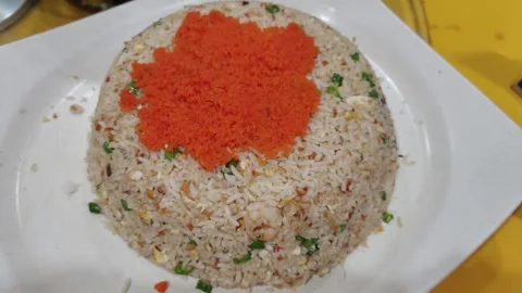 Close-up view of the Yangzhou fried rice with fish eggs on the plate. 動画素材 241223205