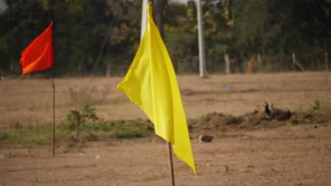 Close view of yellow and orange flags waving with wind Stock Footage 147705710