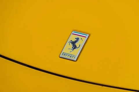 Close-up view of a yellow Formula One Ferrari rear wing, with Italian flag .. Stock Photos