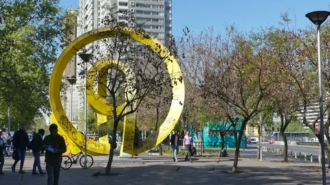 Close up view of yellow, graffiti-tainted abstract sculpture Stock Footage 97863432