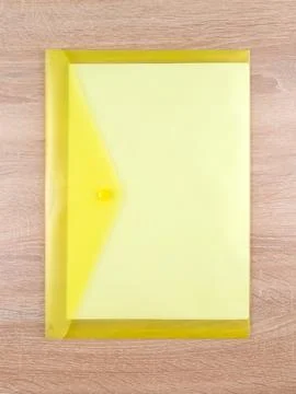 Close-up view of yellow  plastic document folder on office table Foto stock
