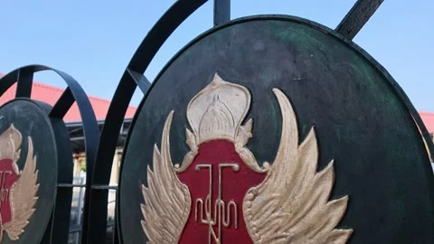 Close-up view of the Yogyakarta Palace emblem on the fence of Gedhe Kauman Stock Footage 345411316