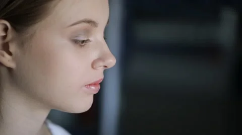 Close up view of young and beautiful woman is sitting in room Stock Footage 67274426