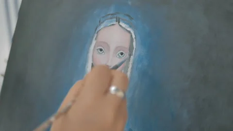 Close up view of young artist hand with brush painting portrait Stock Footage 130617847