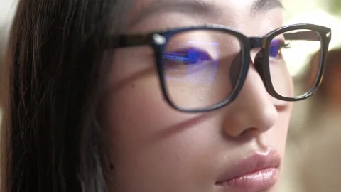 Close-up view of young beautiful professional female developer coding in glasses Stock Footage 228931110