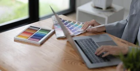 Close-up view of young graphic designer editing his project in comfortable 스톡 사진