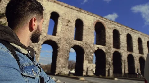 Close up view of young handsome bearded man in casual outfit looking at the 스톡 동영상 105274784