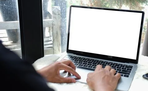 Close up view young man hand typing on keyboard of laptop computer. Stock Photos