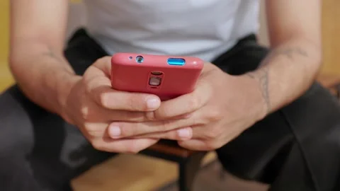 Close up view of young man using smartphone for communication Stock Footage 345095791