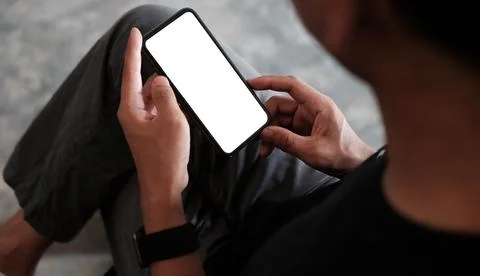 Close up view young man using smart phone. Blank screen for your information. Stock Photos