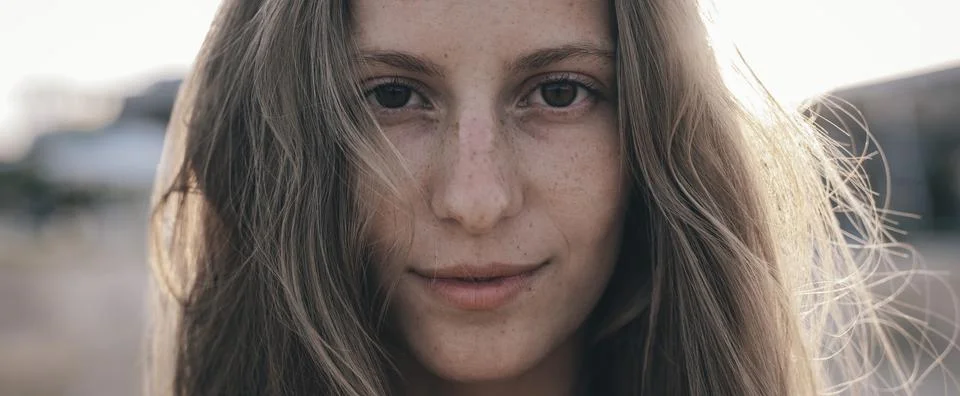 Close-up view of young model with many freckles and natural beauty. Stock Photos