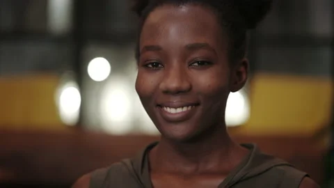 Close up view of young positive afro american woman turning head while smiling Stock Footage 152287605
